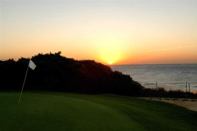 Sunset over Novo Sancti Petri Golf Course and the sea